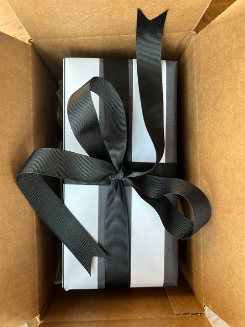 Black and white thick stripe paper with thick black grosgrain ribbon.